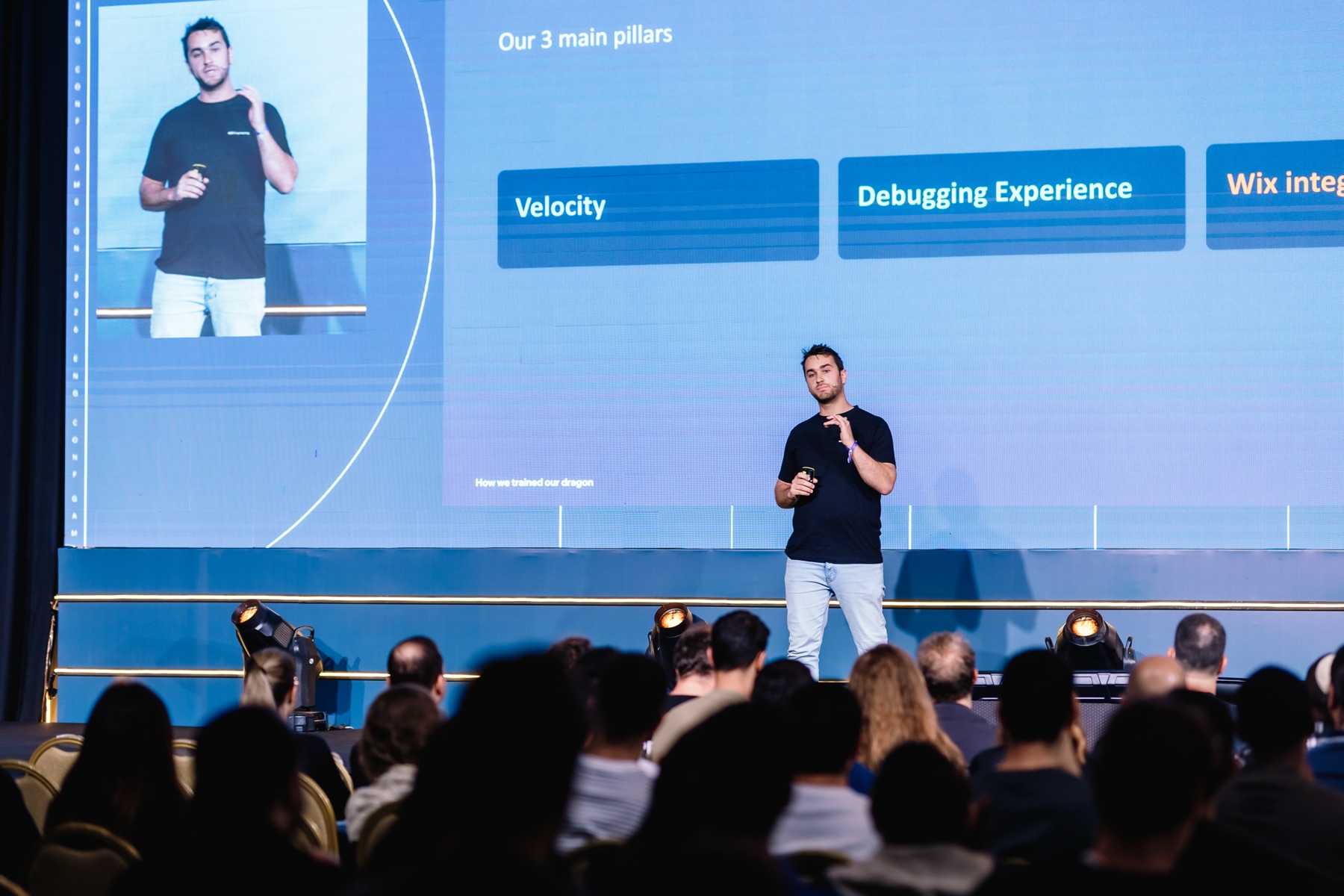 David Gahnassia on stage at Wix Engineering Conference 2026, presenting to an audience of engineers